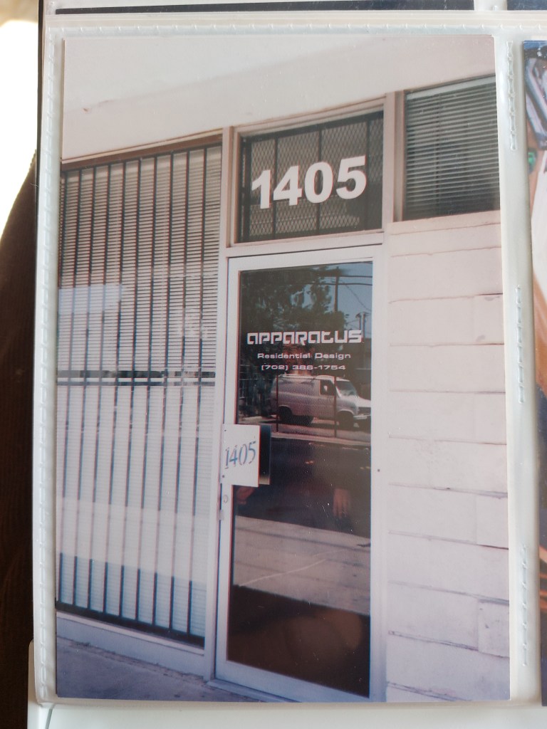 Front entrance of a building with the number '1405' and the name 'APPARATUS Residential Design' displayed on the door.