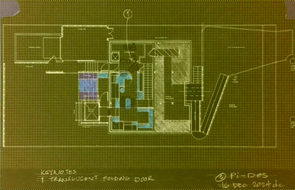 Architectural floor plan featuring a detailed layout of a building, including rooms and furniture placements, with notes indicating key features like a translucent folding door.